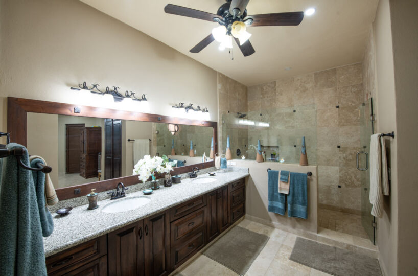 Gorgeous Custom Four Bed/Three Bath Home: primary bath with walk in tiled shower and double vanity