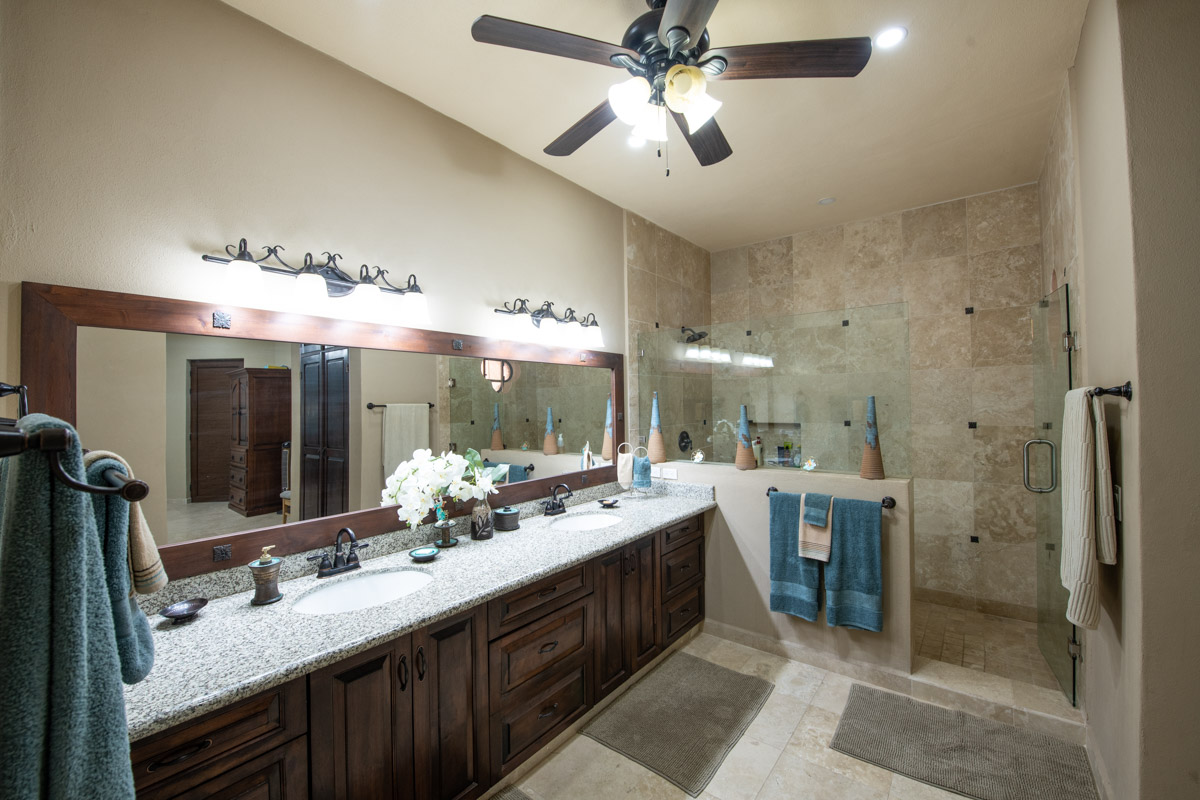 Gorgeous Custom Four Bed/Three Bath Home: primary bath with walk in tiled shower and double vanity